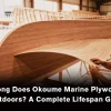 Worker installing Okoume marine plywood for wooden boat construction inside boatbuilding workshop