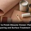 Okoume veneer surface being painted and lacquered to achieve a smooth, durable, and decorative wood finish.